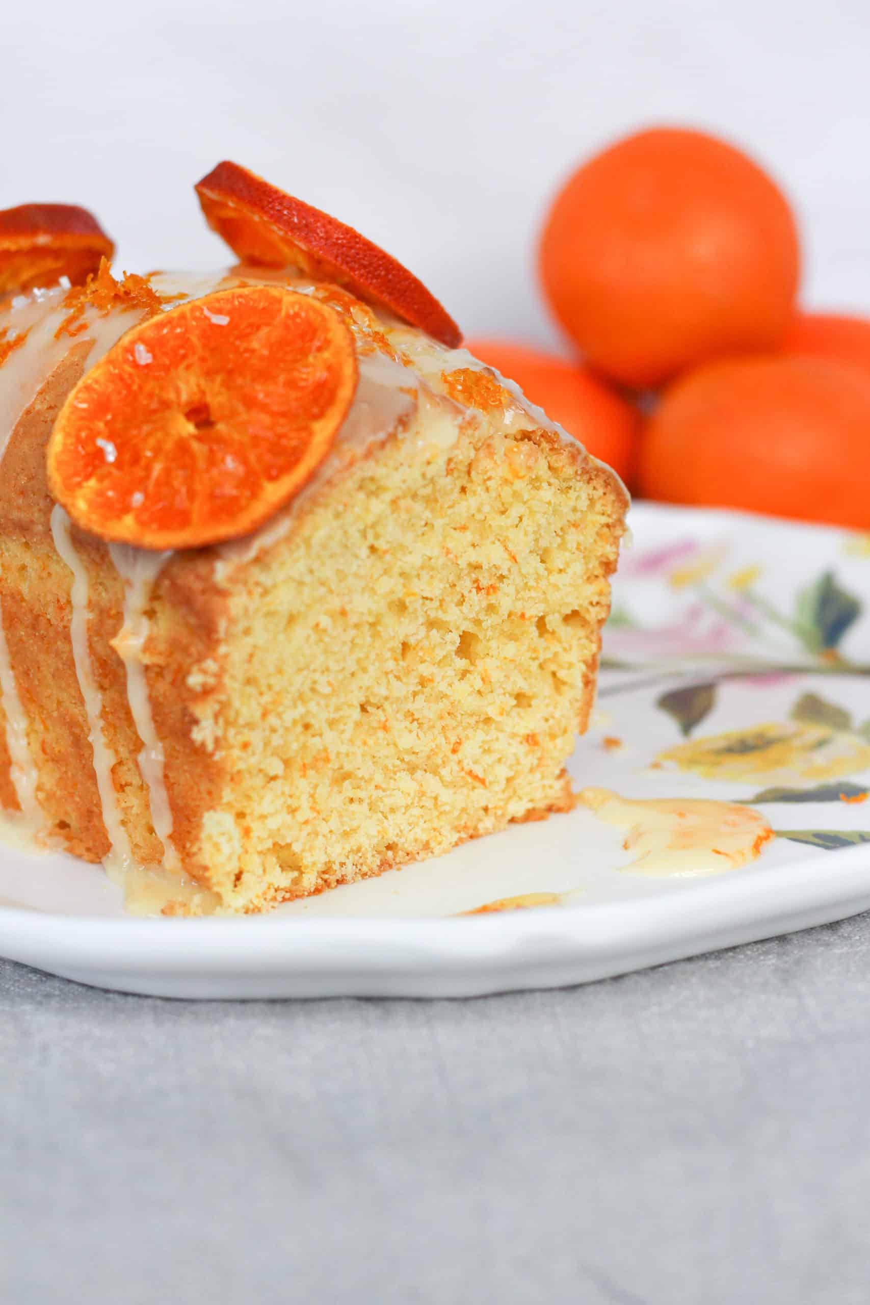 sliced loaf of clementine bread topped with dried oranges