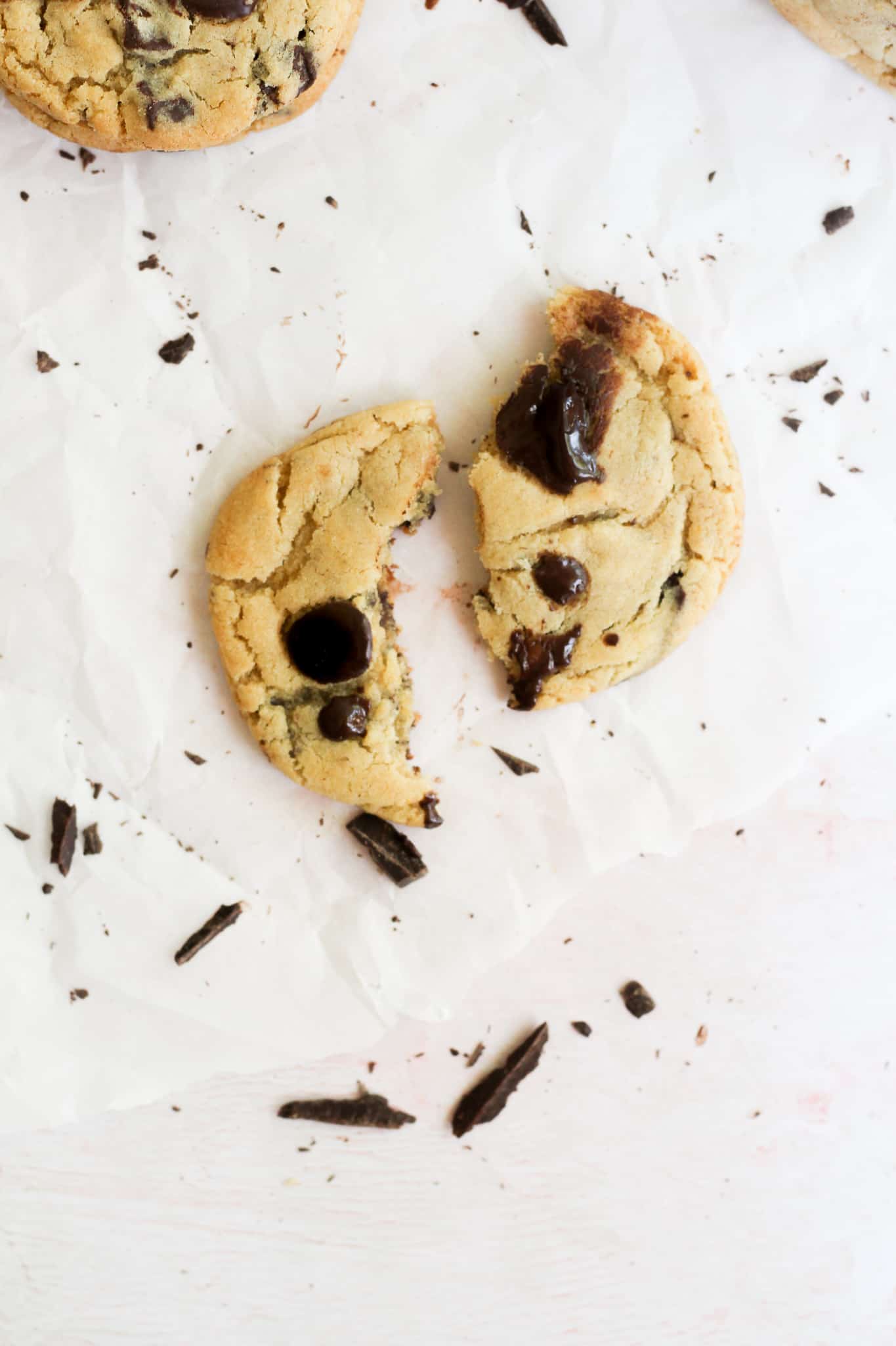 chocolate chip cookie broken into two pieces