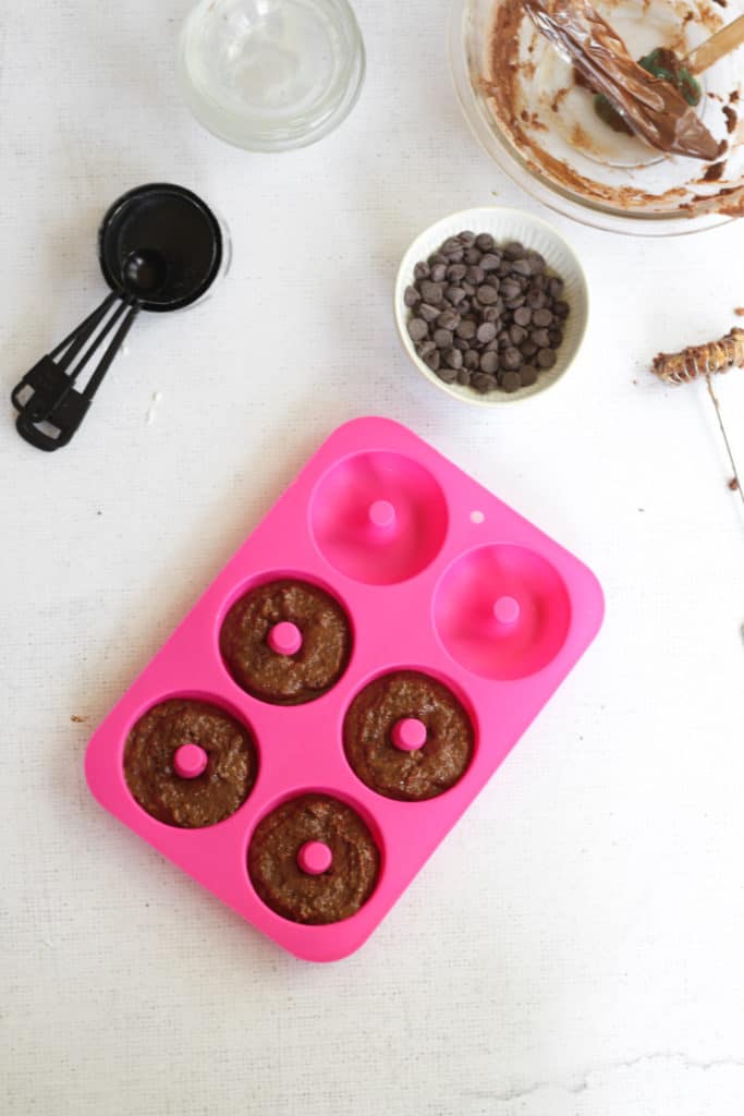 chocolate donut batter in donut pan
