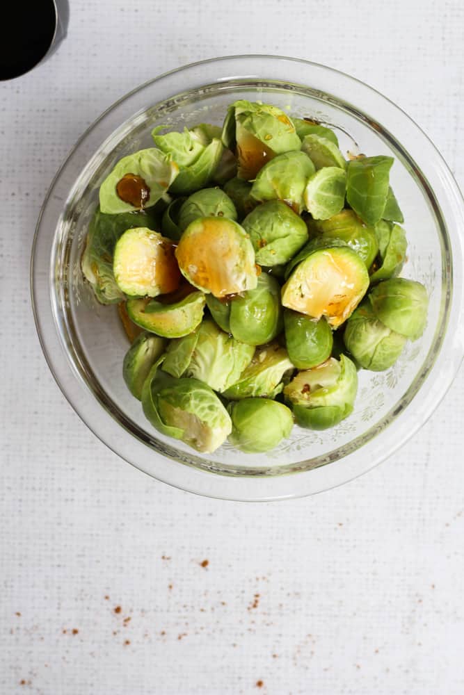 brussels sprouts with maple syrup in a clear bowl