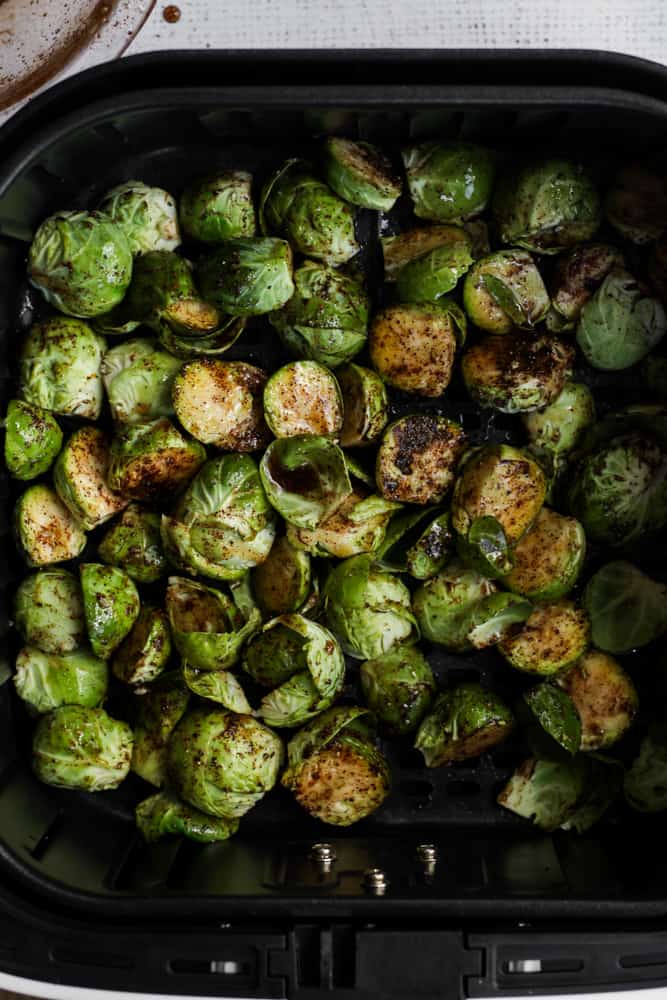 air-fryer basket with maple chili seasoned brussels sprouts