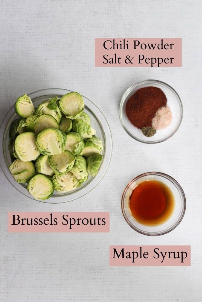 gray backdrop with air-fryer brussels sprouts ingredients labeled with pink text boxes