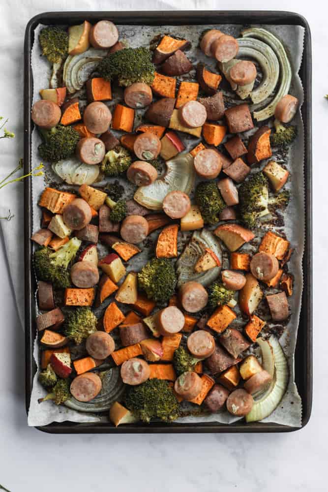 easy weeknight sheet pan dinner fully cooked on white backdrop with white napkin