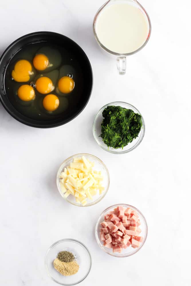 healthy crustless quiche ingredients on a white backdrop