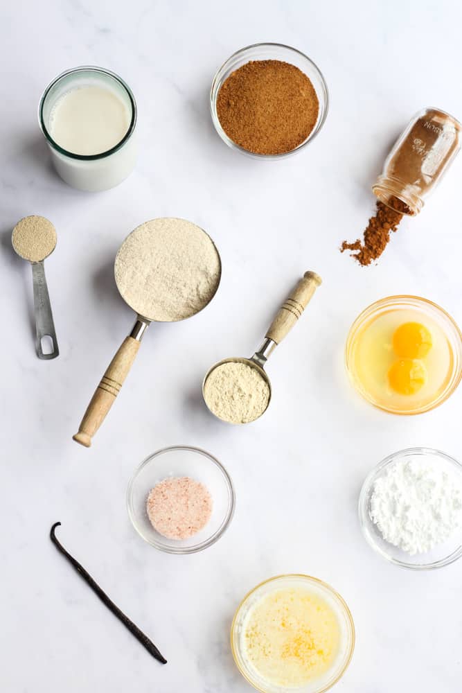 healthy cinnamon roll ingredients on a white backdrop