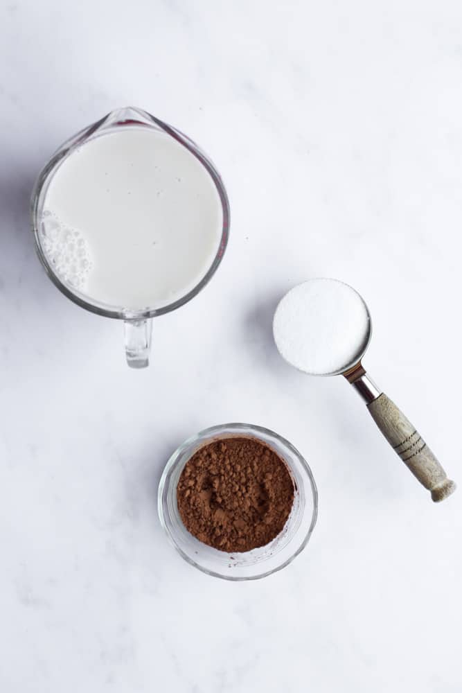 hot chocolate made with almond milk ingredients on a white backdrop