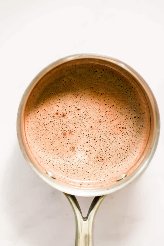 healthy hot cocoa in a silver pot.