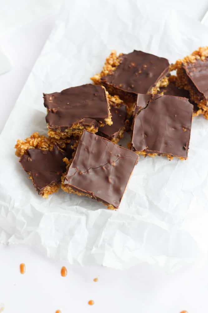 healthy Christmas cookie bars coated in chocolate on parchment paper