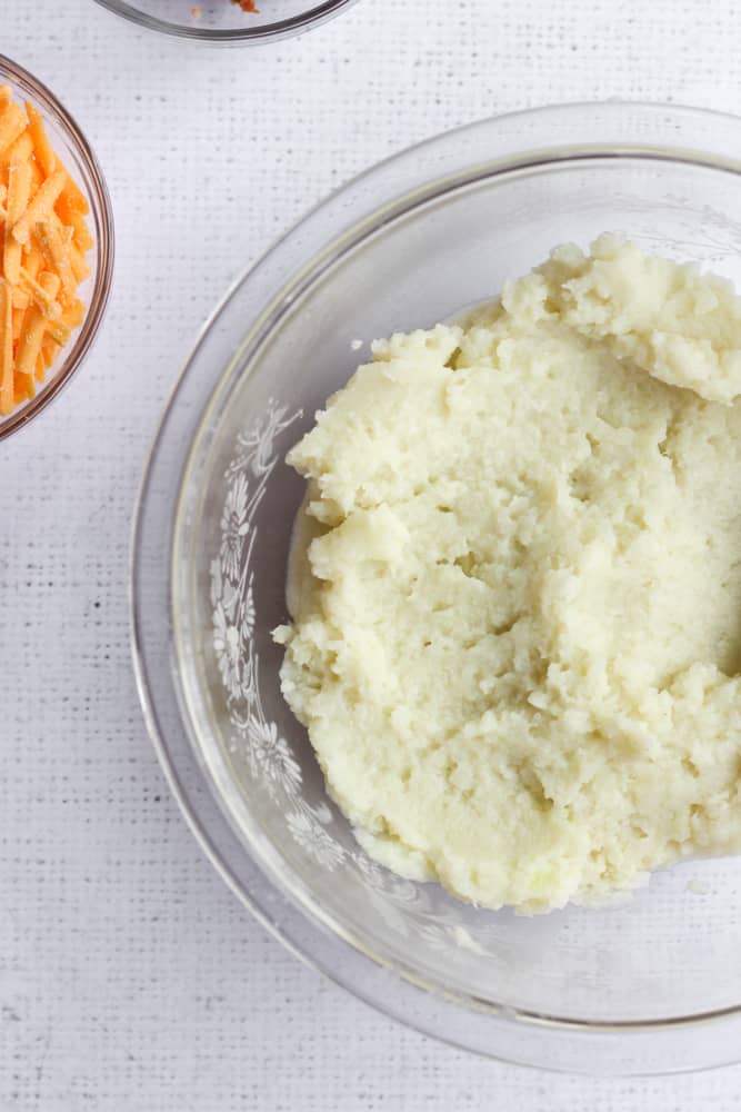mashed cauliflower in a clear bowl