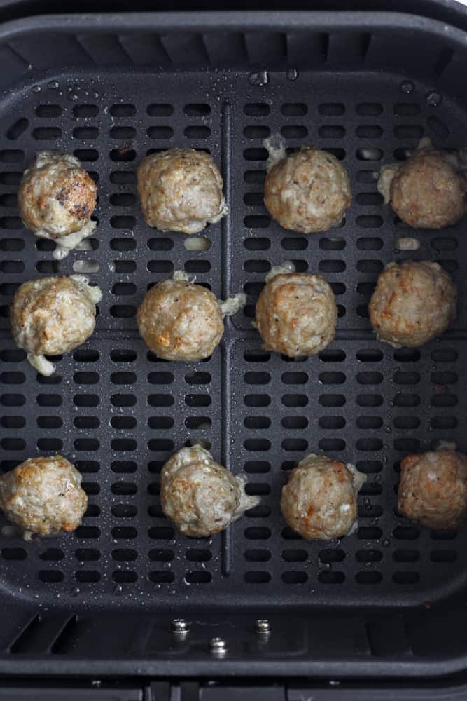 healthy turkey meatballs cooked in an air fryer basket