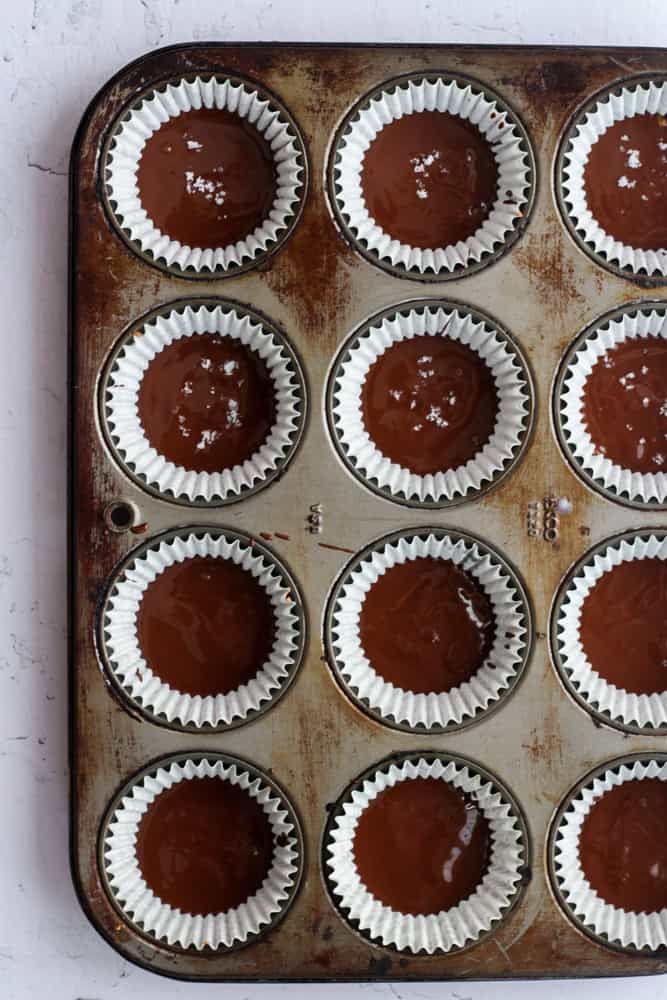 almond butter cups in a cupcake pan