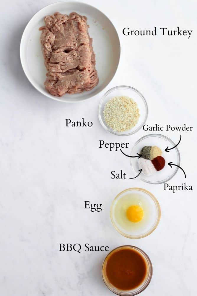 healthy turkey meatball ingredients on a white backdrop labeled with black text