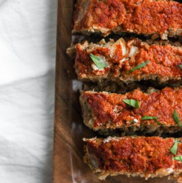gluten free meatloaf sliced on a wooden cutting board