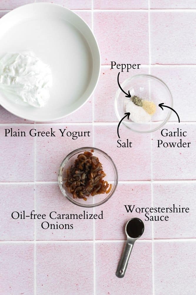 healthy French onion dip ingredients on a pink backdrop labeled with black text