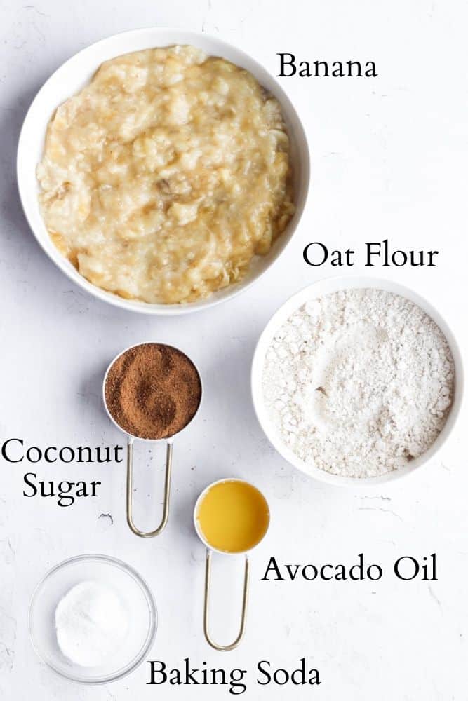 5 ingredient banana bread ingredients on a white backdrop each one is labeled with black text