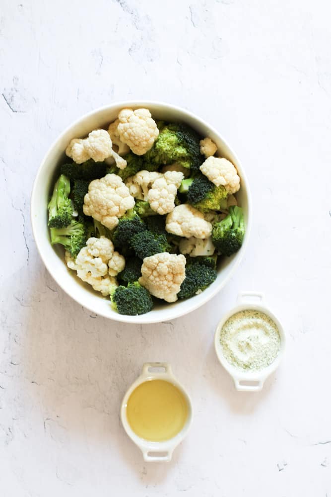 ingredients for air fryer roasted broccoli on a white backdrop