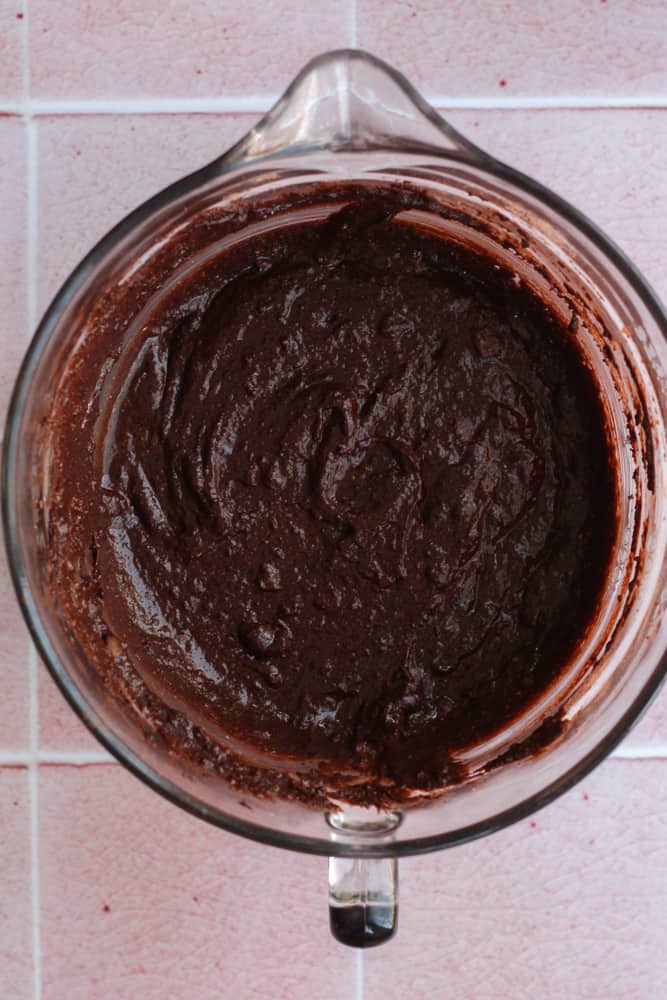 healthy chocolate cake batter in a glass bowl