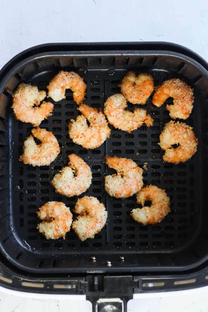 gluten free fried shrimp cooked in an air fryer basket