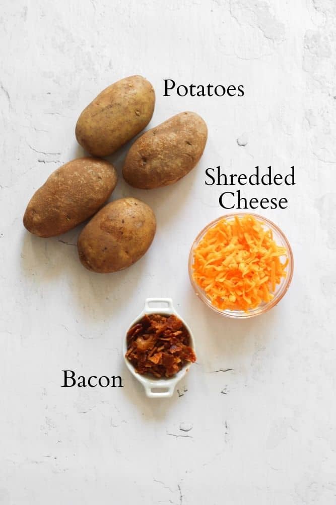 air fryer potato skin ingredients on a white backdrop labeled with black text
