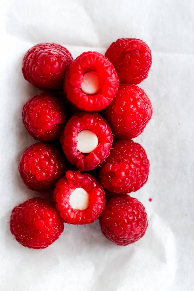 raspberries stuffed with a white chocolate chip.