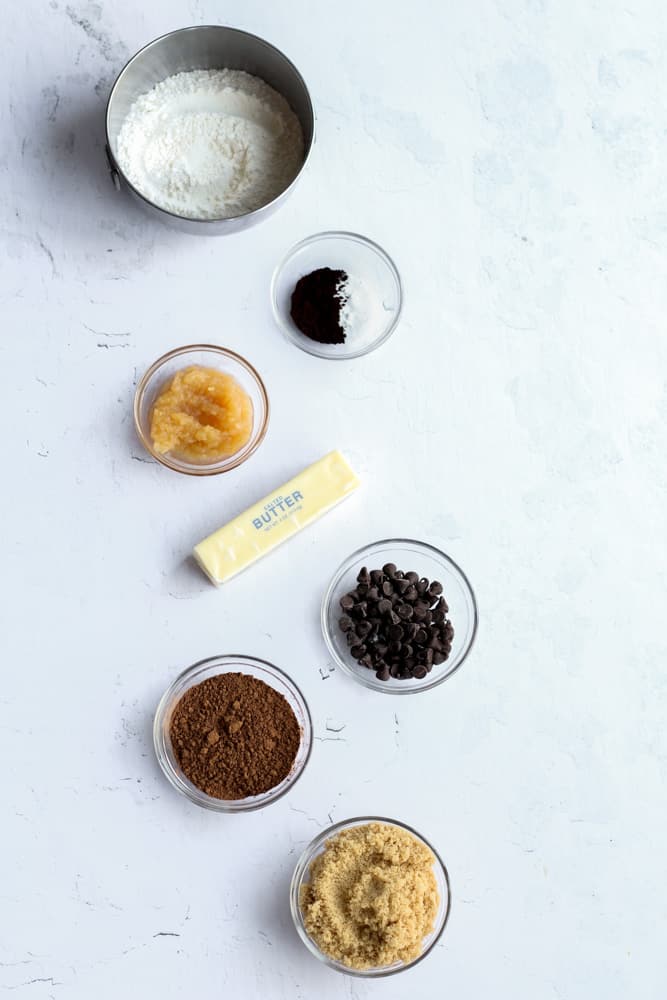 eggless chocolate cookie ingredients on a white backdrop.