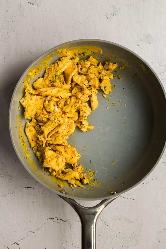 healthy dairy free scrambled eggs cooked in a blue pan.
