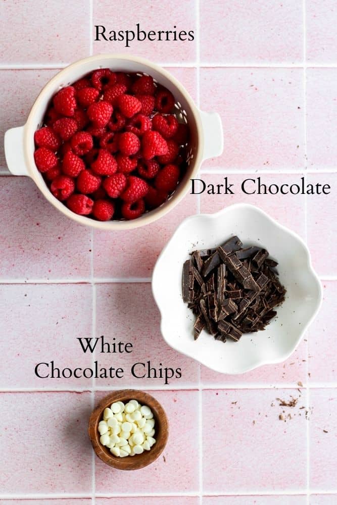 chocolate covered raspberry ingredients on a pink backdrop labeled with black text.