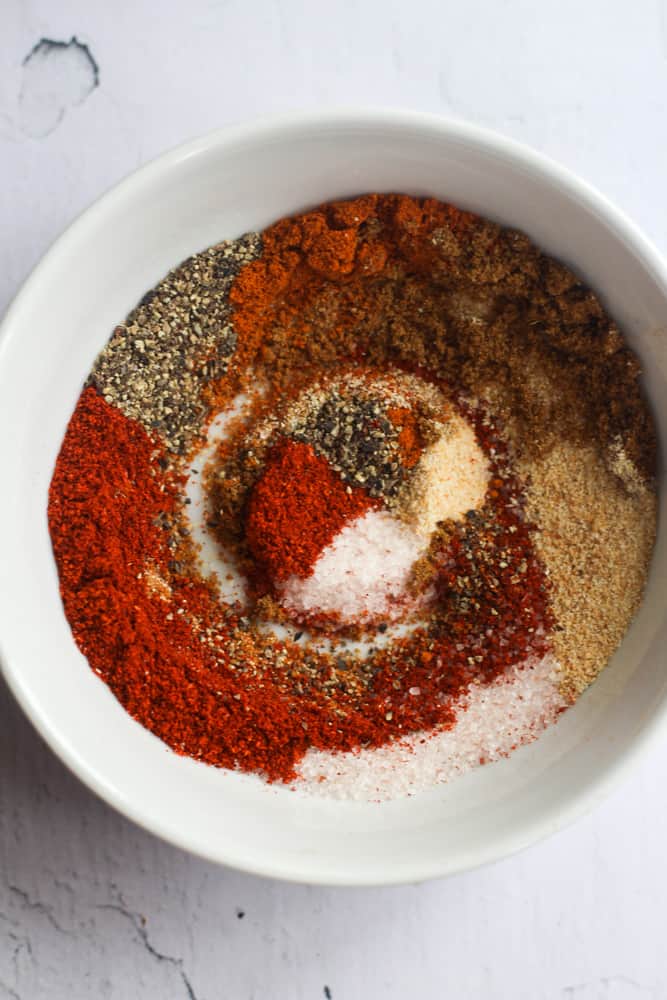 spices stirred in a white bowl.