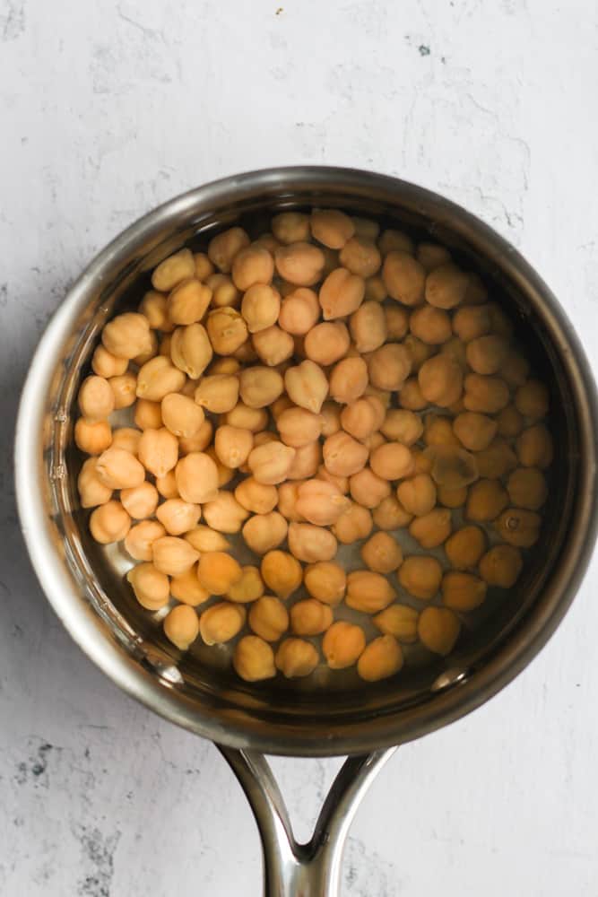 chickpeas in a silver pot.