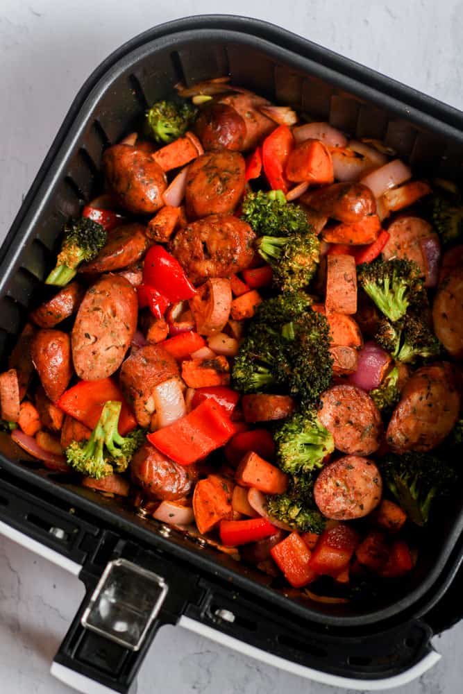 chicken sausage and roasted vegetables cooked in air fryer basket.