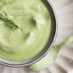 avocado lime ranch dressing in a bowl topped with fresh dill.