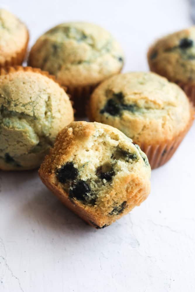 dairy free blueberry muffin with a bite taken out of it.