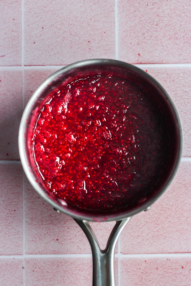 healthy raspberry sauce in a saucepan.