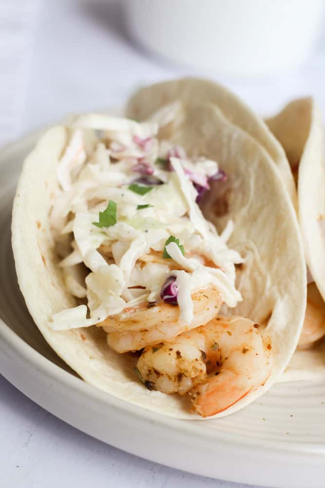 simple slaw for tacos on top of shrimp.