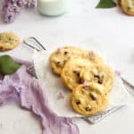chocolate chip cookies without brown sugar on parchment paper with a purple napkin.