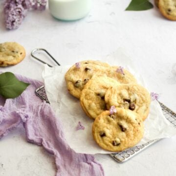 chocolate chip cookies without brown sugar on a piece of parchment paper with a purple linen.