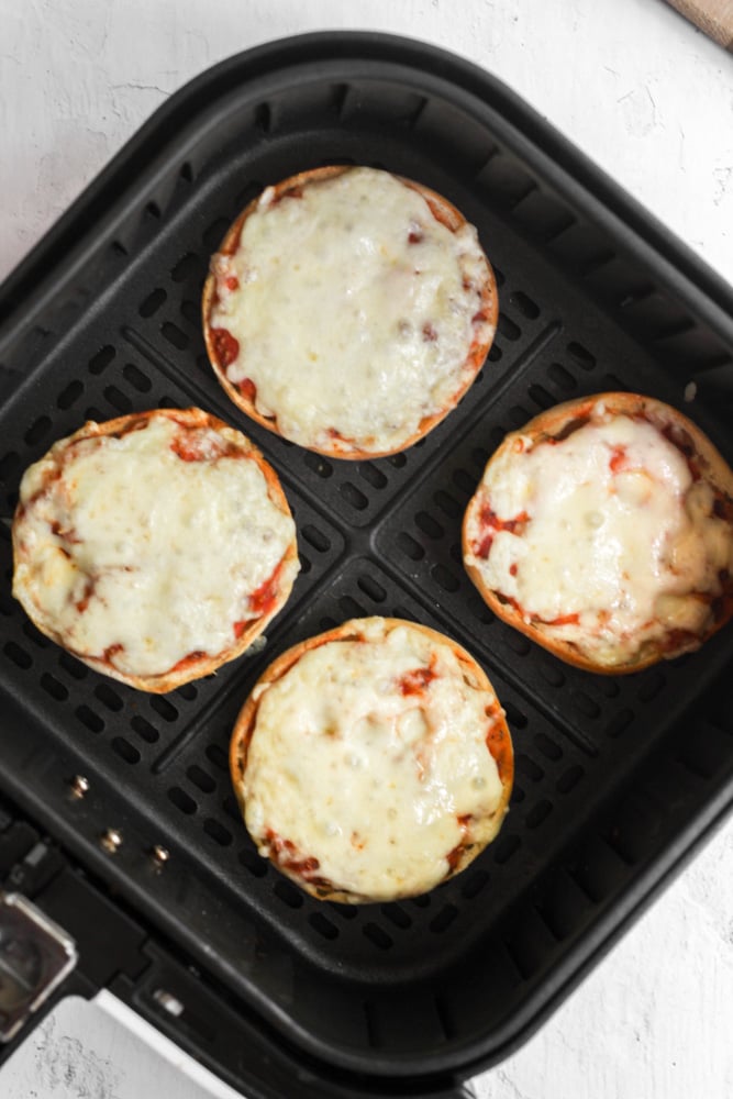 Air Fryer English Muffin Pizzas with melted cheese.