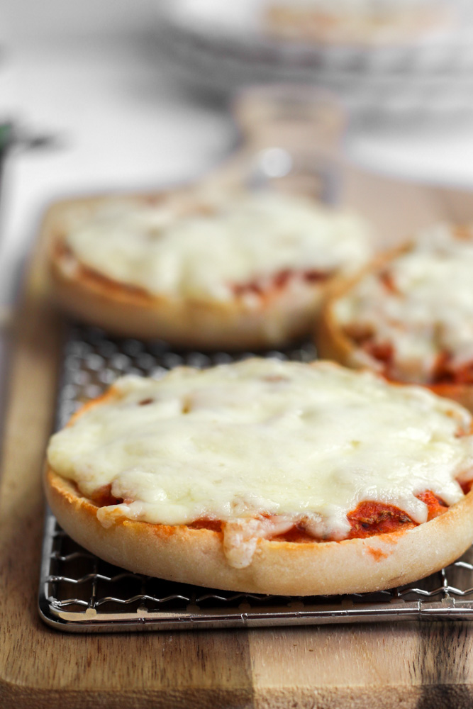 healthy english muffin mini pizza with melted cheese.