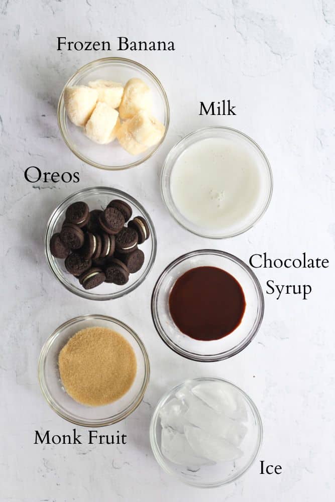 ingredients for a oreo milkshake without ice cream labeled with black text.