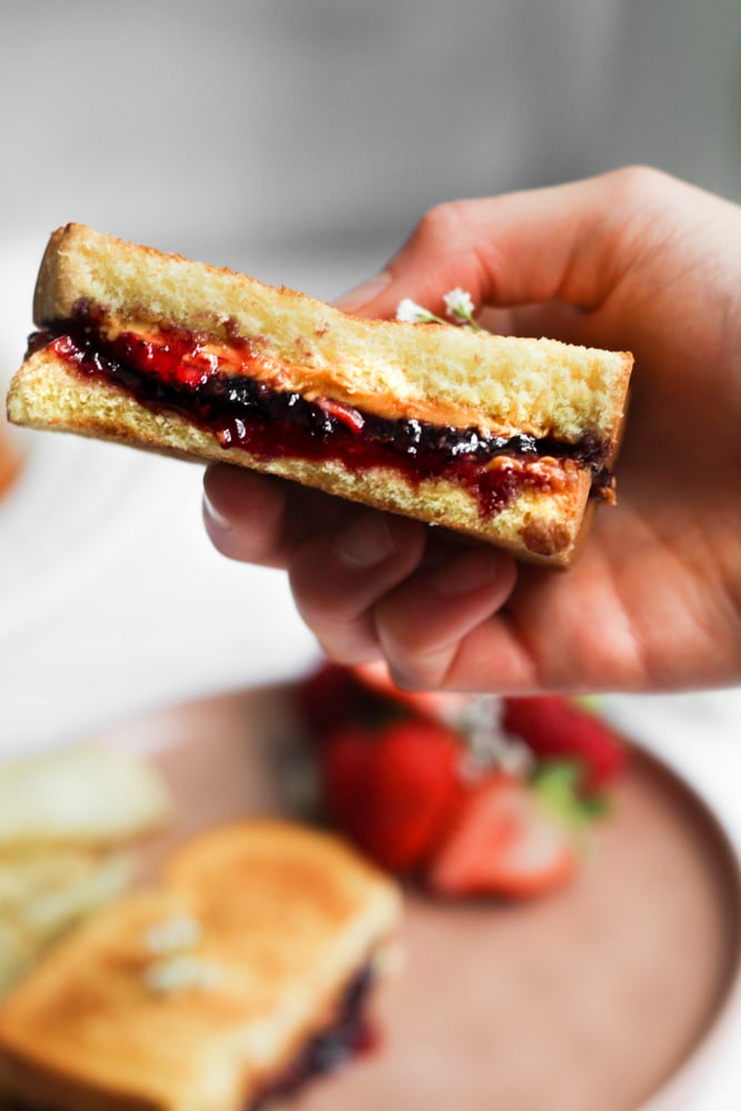 hand holding a grilled peanut butter and jelly.