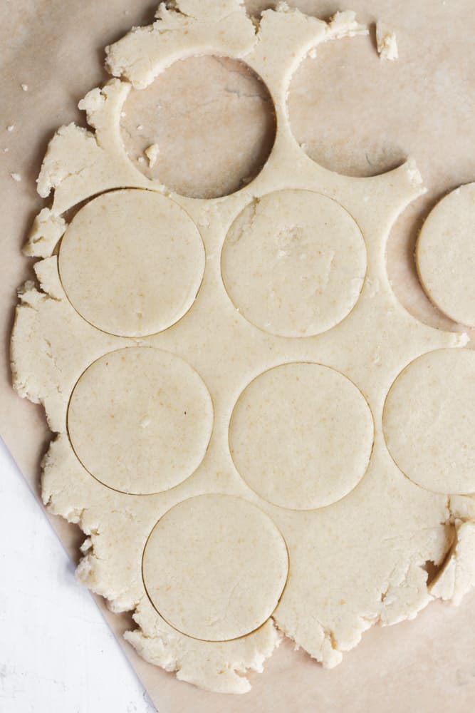 Cookies cut out in dough.