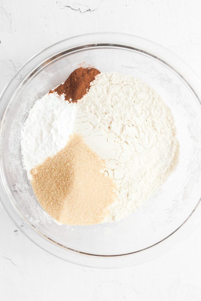 dry ingredients for healthy pancakes in a glass bowl.