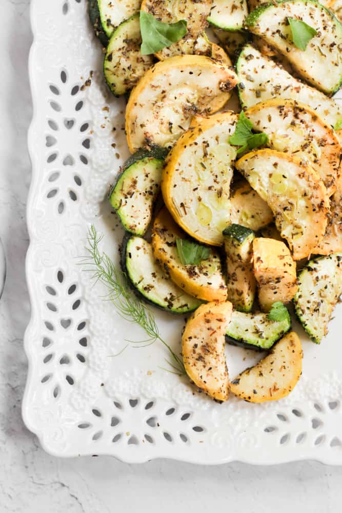 air fryer zucchini and squash on white platter.