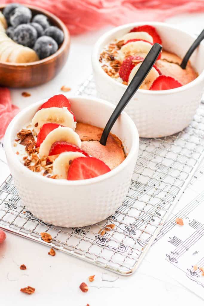 air fryer baked oats topped with banana and strawberries.