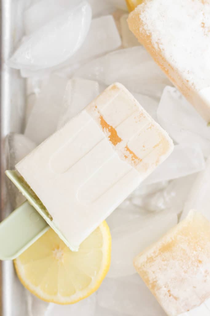 frozen sugar free lemon popsicle on ice cubes.