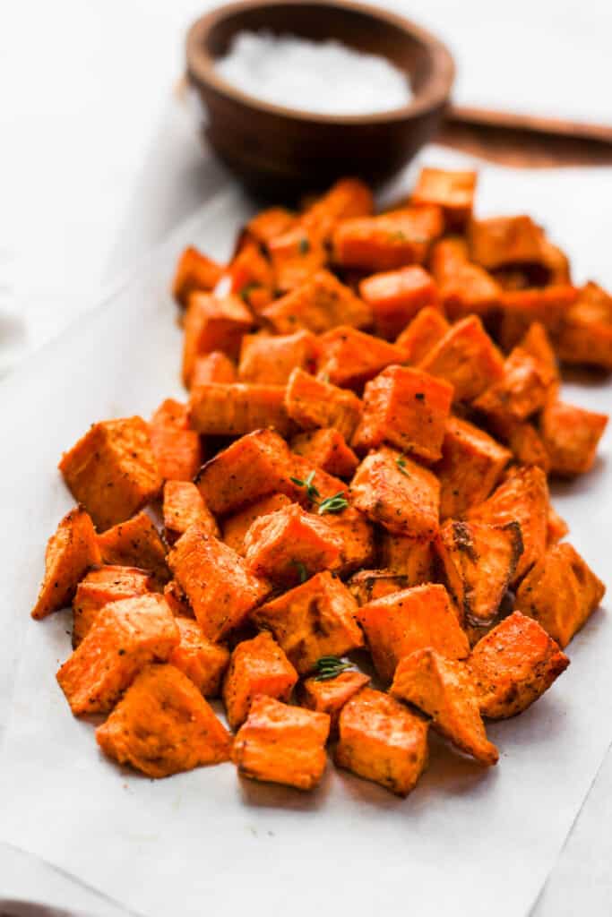 air fried sweet potato chunks on parchment paper.