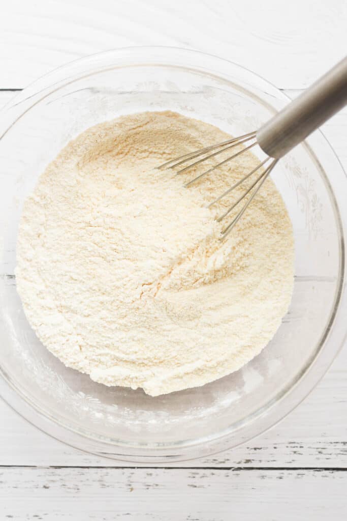 flour and cornmeal whisked in a glass bowl.
