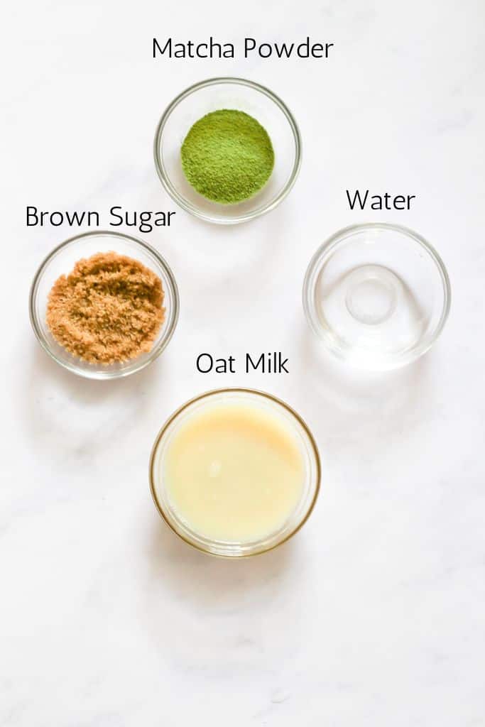 ingredients for an oat milk matcha latte labeled with black text.