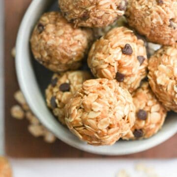 3 Ingredient Peanut Butter Oatmeal Balls with chocolate chips in white bowl.