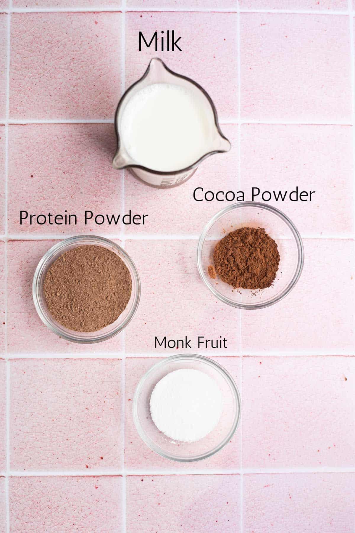 ingredients for protein hot chocolate labeled with black text.
